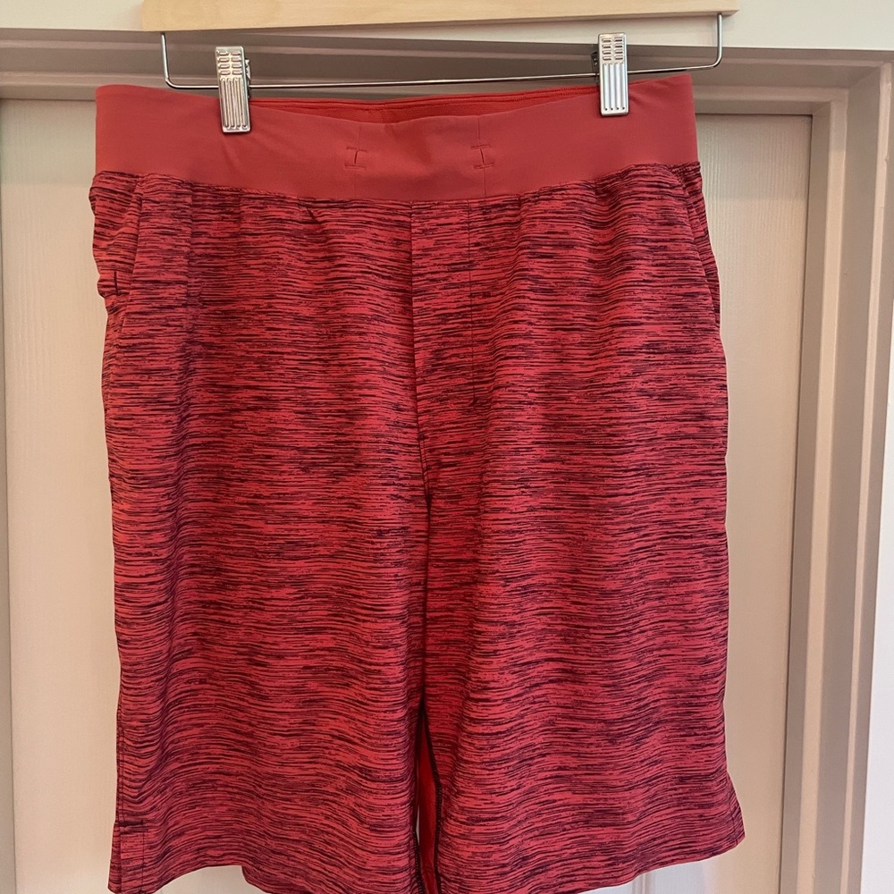 Lululemon men’s short. Size medium 9” inseam. Burnt Orange and Black